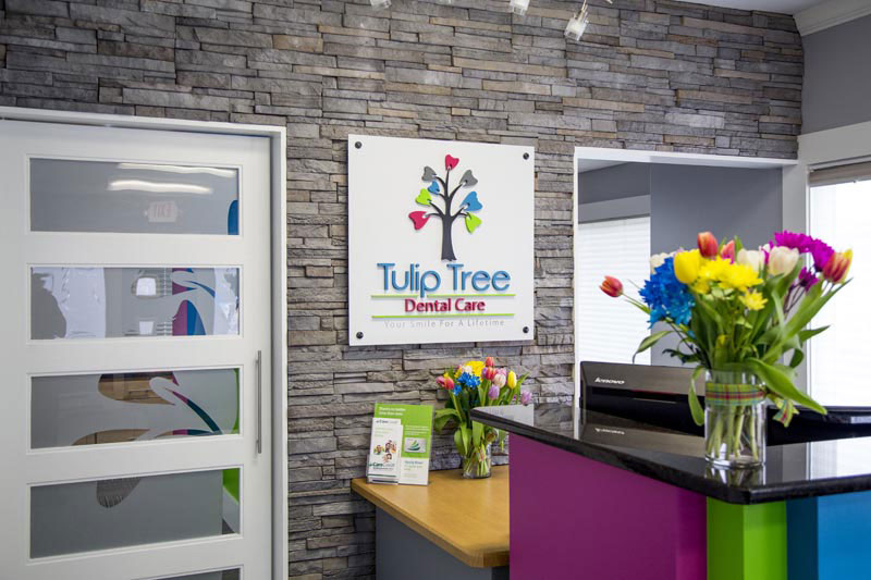 front desk and sign at Tulip Tree Dental Care